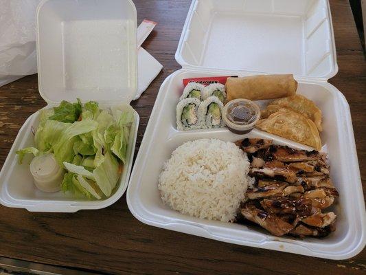 Side salad. Chicken Terriyaki bento box with 4 piece California roll, one spring roll, 3 gyoza and white rice.