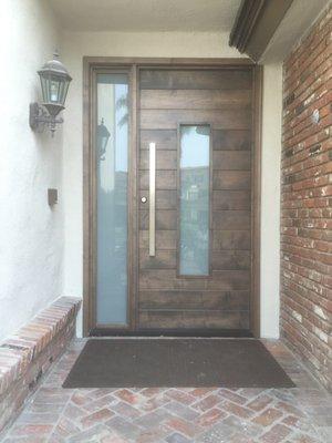 Custom plank door with white laminated glass