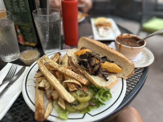 Irish sausage sandwich with cheese, mushrooms, and a side of chili