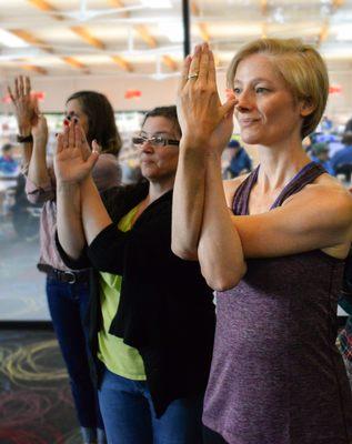 Eagle arms pose with Nadine Blinn from Balanced Humans Office Yoga