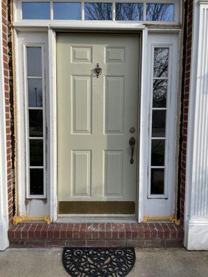 Old front door put back in due to measuring the new one wrong.