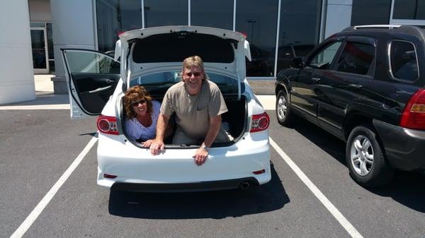 The Crummetts with their new #Corolla. Congratulations! Having fun in the trunk! Sales Associate: Chad Hudnall