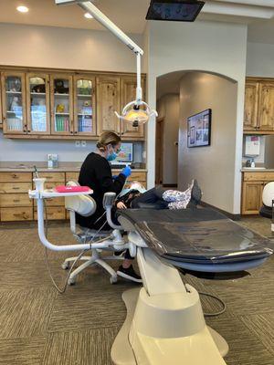 My daughter has never had a cavity and look how relaxed (her crossed legs) she is watching Apple TV while getting her teeth cleaned.