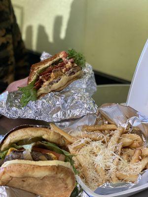 Classic burger in front, White Truffle Parmesan fries, and Pimento Cheese burger in back