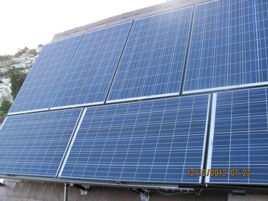 PV panels on highly pitched angle in San Francisco Noe Valley.  This customer charges a Teslar with this system.