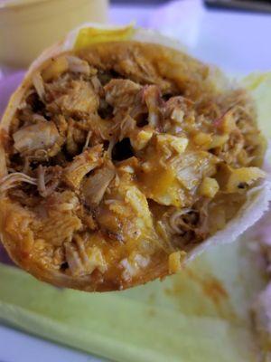 Close up of a chicken breakfast burrito