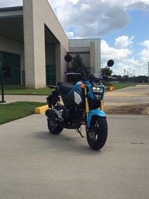 Honda Grom MSX 125 motorcycle in front of Lafayette Airport.