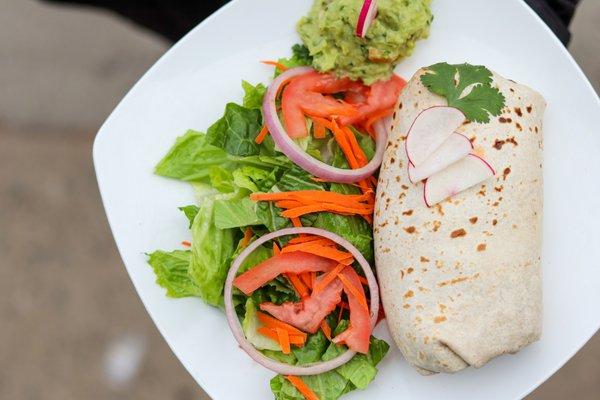 Portobello Mushroom Burrito with salad and guacamole, served Taqueria Milear style