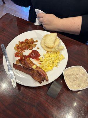 Country breakfast, hard potatoes, scrambled eggs and bacon with a weird taste