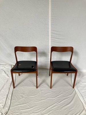 Dual Moller chairs made in Denmark  by Schou Anderson. These pieces will be disassembled and the vinyl will be replaced with black leather.