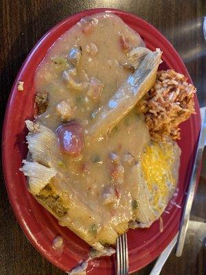 Tamales smothered in green chile sauce