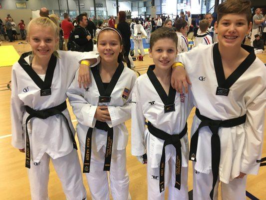 Four PST Junior Black Belts at local Taekwondo Tournament.  Tournaments are and important option in Sport Taekwondo