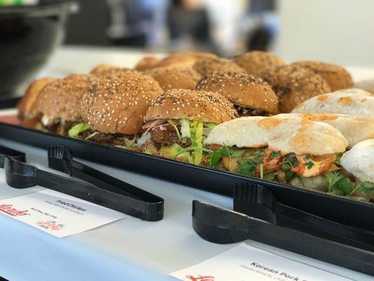 Mini sliders from Lardo, one of Portland's best sandwich shops. Set up in an office with labels and serving utensils!