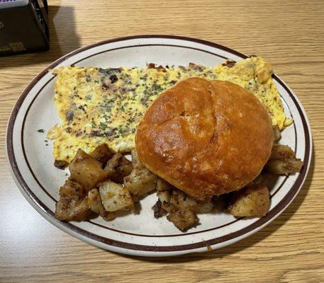 Bacon & cheese omelette with house potatoes and a "biscuit"