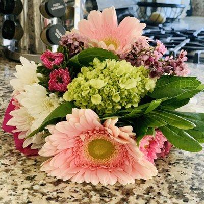 Pre-made bouquet with gerbera daisies and roses for $15.