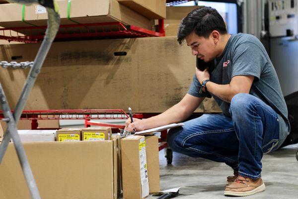 Our parts manager organizing parts and making calls to ensure a everything goes as planned.