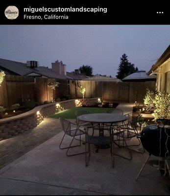 Picture of backyard at night with lights installed