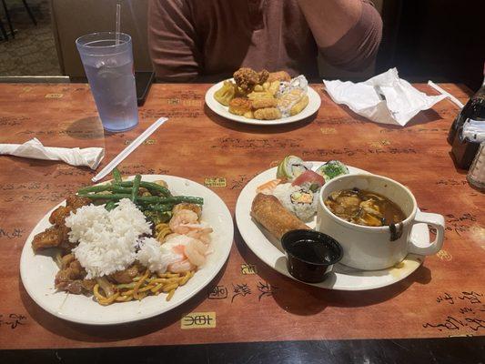 Variety of dinner options - egg roll, hot & sour soup, rice, green beans