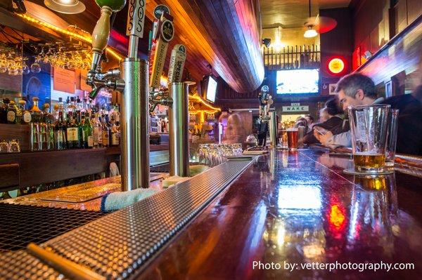 Extensive bar area, beautiful woodwork thought the place. Credit: Jim Vetter Photography