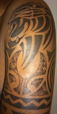 Tribal tattoo with black panther as center piece