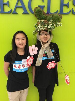 Students show off their wearable art from an in-school STEAM residency.