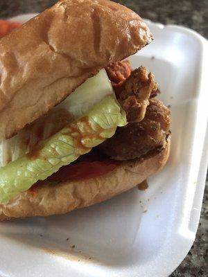 Shrimp Po' Boy. On a Toasted French Roll with Lettuce and Tomato served w/ Louisiana Hot Sauce and Waffle Fries.