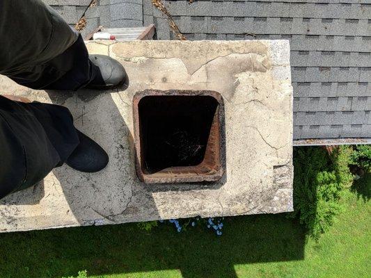 Before picture of a rough cement crown/wash in Newtown Square, Pa. There was at one time a large slate top, notice the brick pattern.