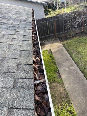 BEFORE and AFTER shots of a local gutter clean for one of our customers.