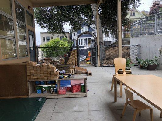 Covered outdoor space by one of the classrooms.