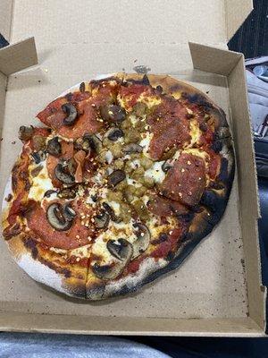 Pepperoni, sausage, and mushroom pizza