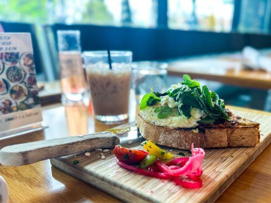 REAL AVOCADO TOAST (V) HOUSE MADE RED PEPPER PESTO, FETA CHEESE, ASIAN GREENS, MINT, AVOCADO, OLIVE OIL, THICK COUNTRY TOAST