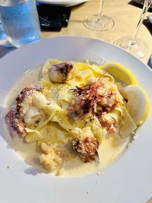 Poached lobster Alfredo over pappardelle noodles. Absolutely delicious!