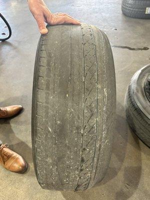 Tire with thread wear on one side at 31,000 mile Bridgestone tires.