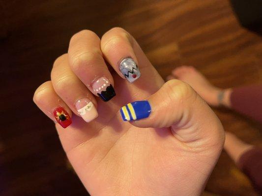 Nails by Daisy. She done my daughter's nails before, this time "Riverdale" theme. Tips and dip. Looks just like the picture she showed her!