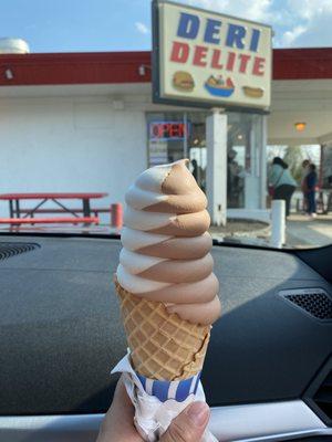 Chocolate and vanilla swirl on a waffle cone. It's huge!