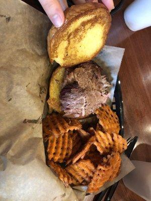 Beef brisket sandwich and sweet potato waffle fries