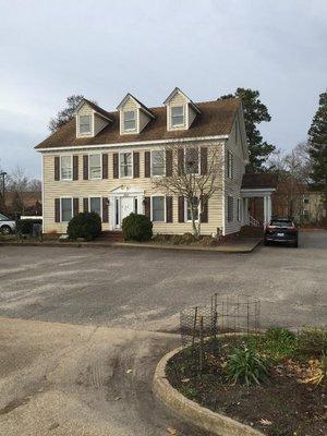 Front of the building.  The front door is on the side in the parking lot