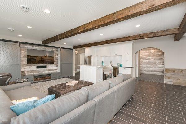 Farmhouse basement remodel with a wet bar.