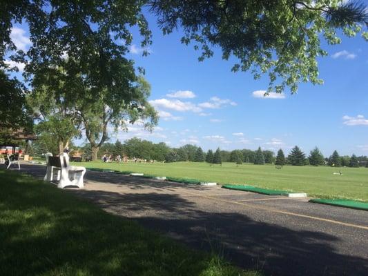 Driving Range can tee up in the grass or use the pads.