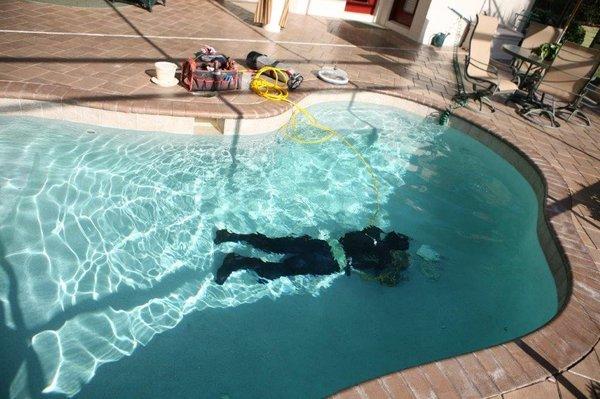 Diving a pool to locate a leak