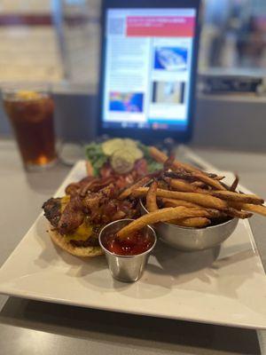 Bacon cheeseburger with fries and iced tea.