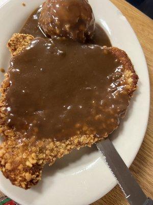 Chicken fried steak & mashed potatoes and gravy.