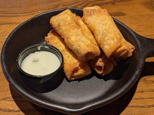 Closer look at the Philly cheesesteak egg rolls with poblano queso dipping sauce