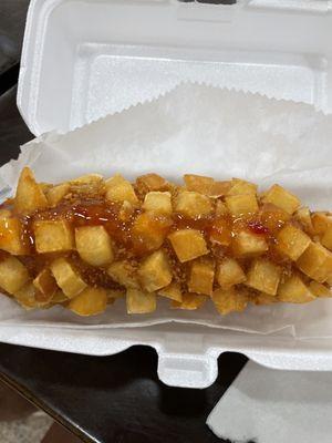 Potato and cheese dog with sweet and sour sauce