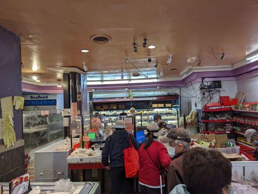 Refrigerated items behind cashier area, 8/1/23