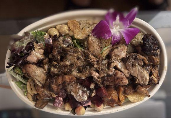 Jerk chicken bowl. Quinoa, mixed greens salad, mushrooms, sweet plantains & chick peas. Yard & jerky jerk sauces.