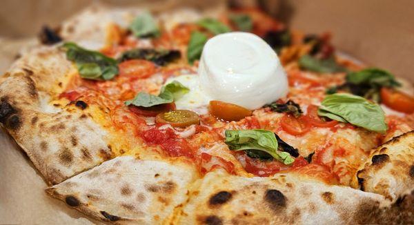 His Margherita Pizza with Burrata in the middle