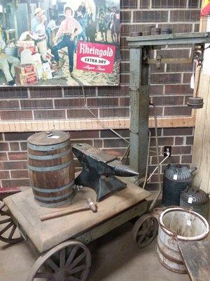 Scale, barrel, anvil, signage