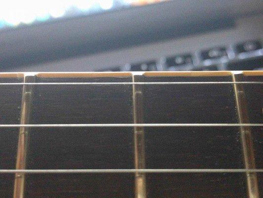 Bad fret levelling, filed on neck