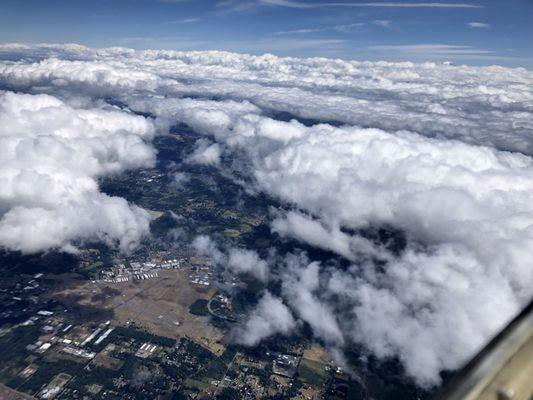 OLM airport under the break in the clouds.  From 11,000 feet.